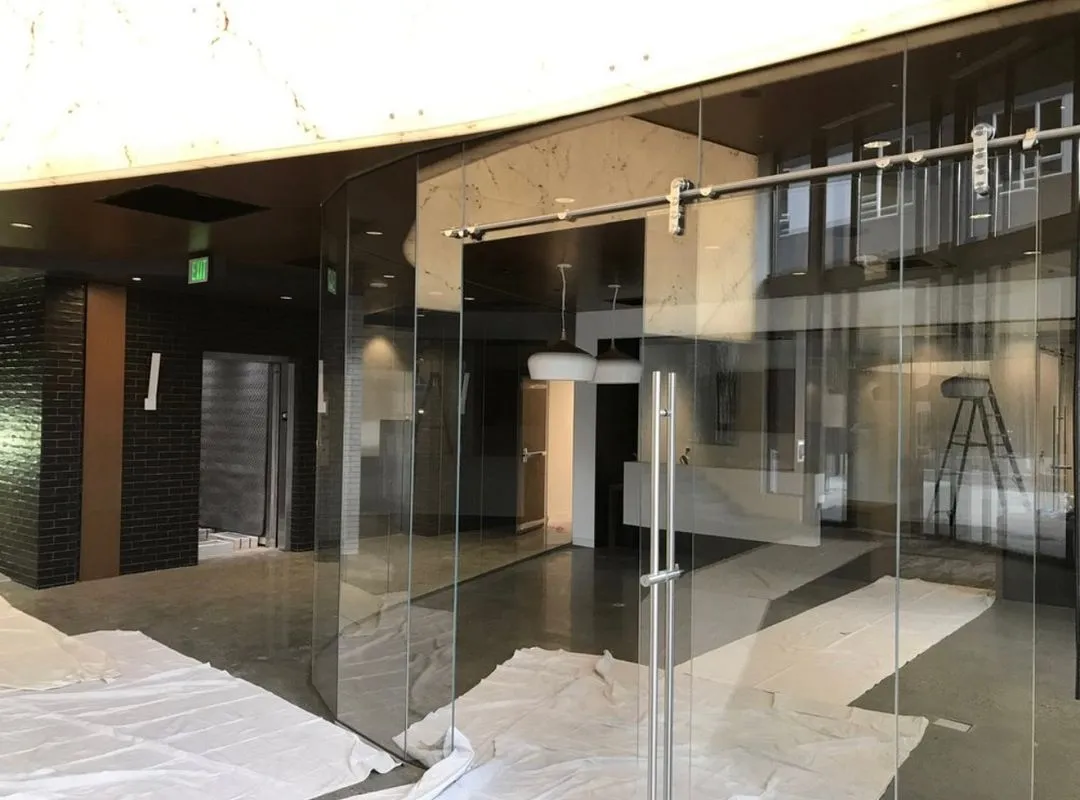 Installing a glass frame room in a modern interior lobby  in Phoenix, AZ