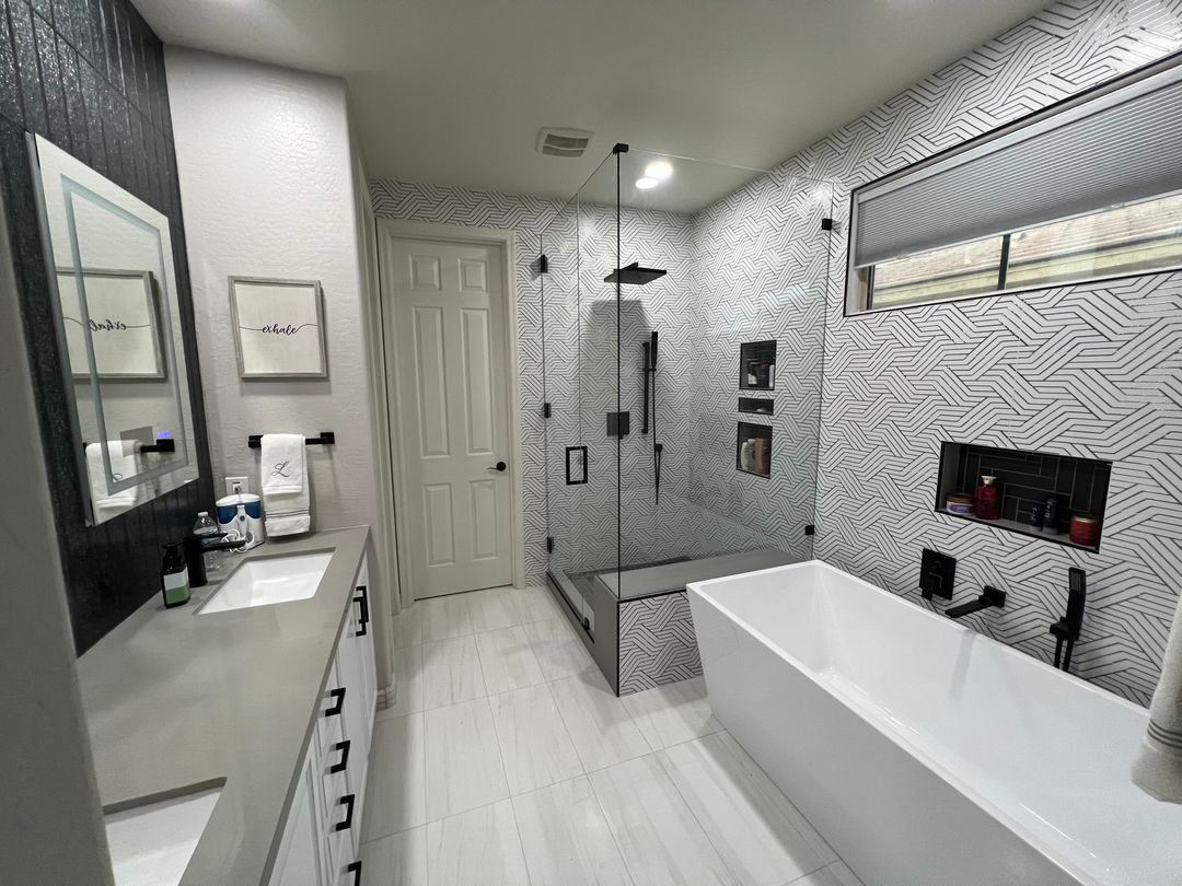Frameless glass shower door installed in a Gilbert bathroom
